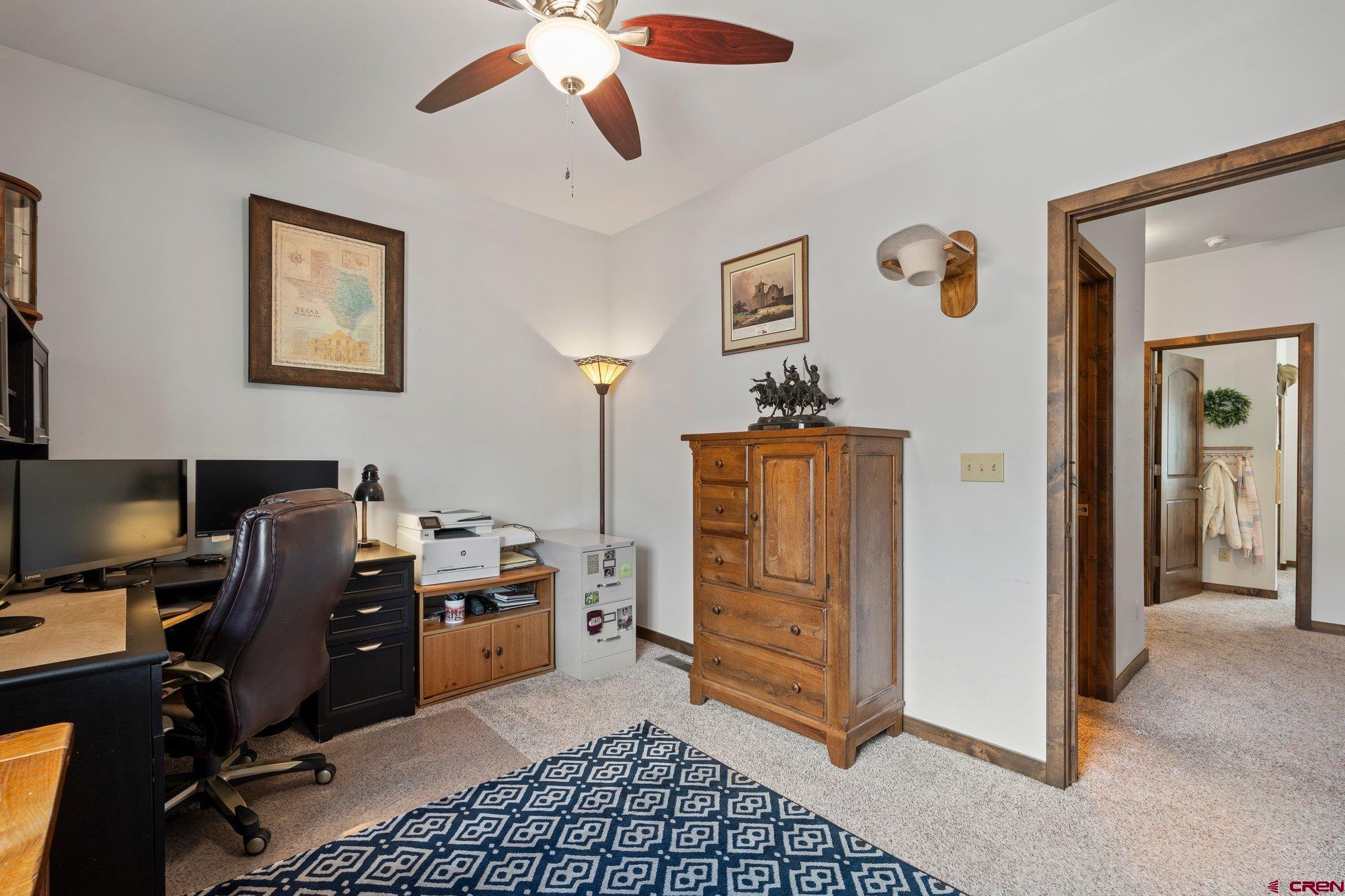 1422 Animas View Drive, Unit 25 Durango, CO 81301 - Photo 21 of 35 a view of a workspace with furniture and a window