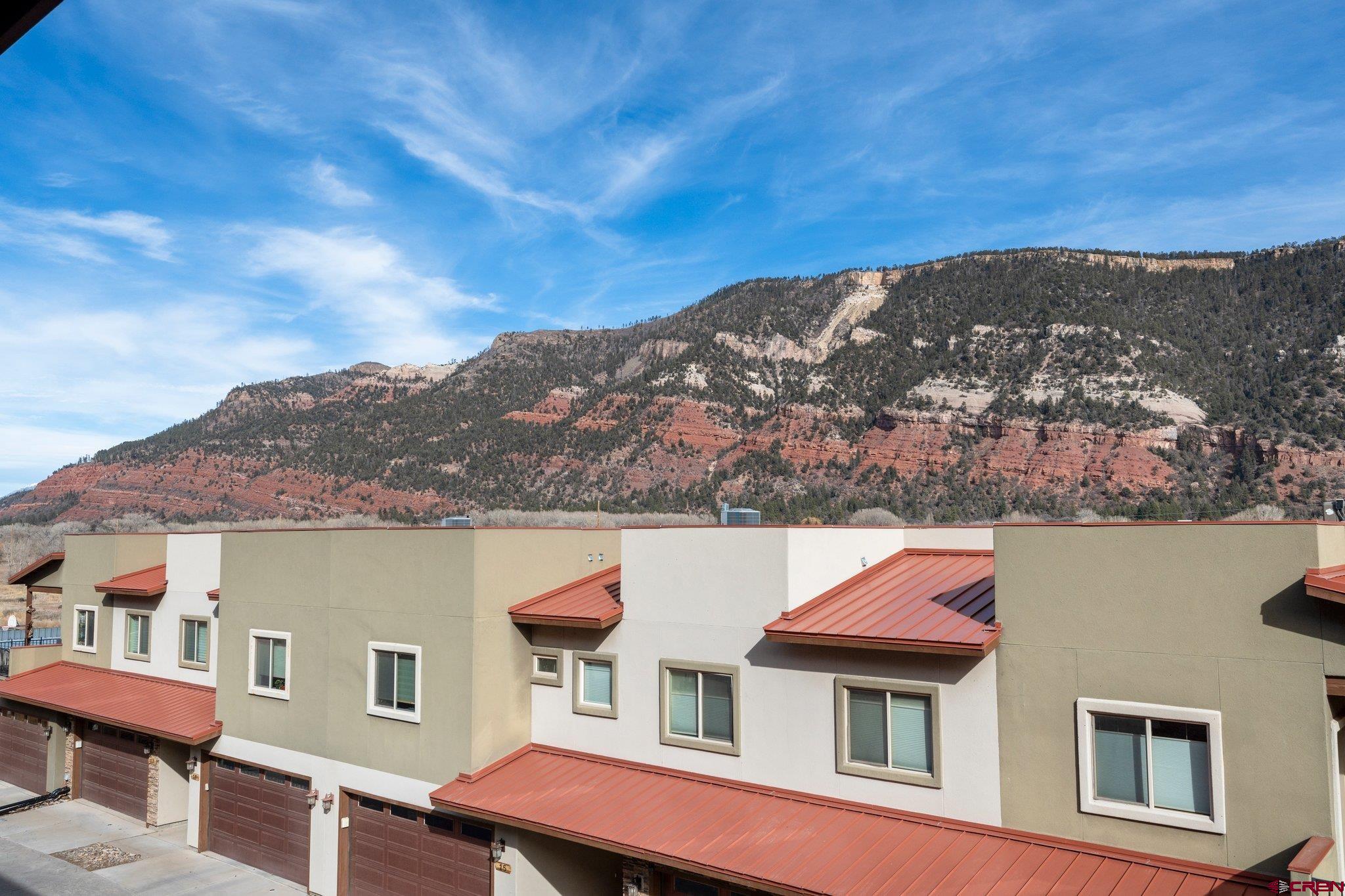 1422 Animas View Drive, Unit 25 Durango, CO 81301 - Photo 28 of 35 a view of houses with a city skyline
