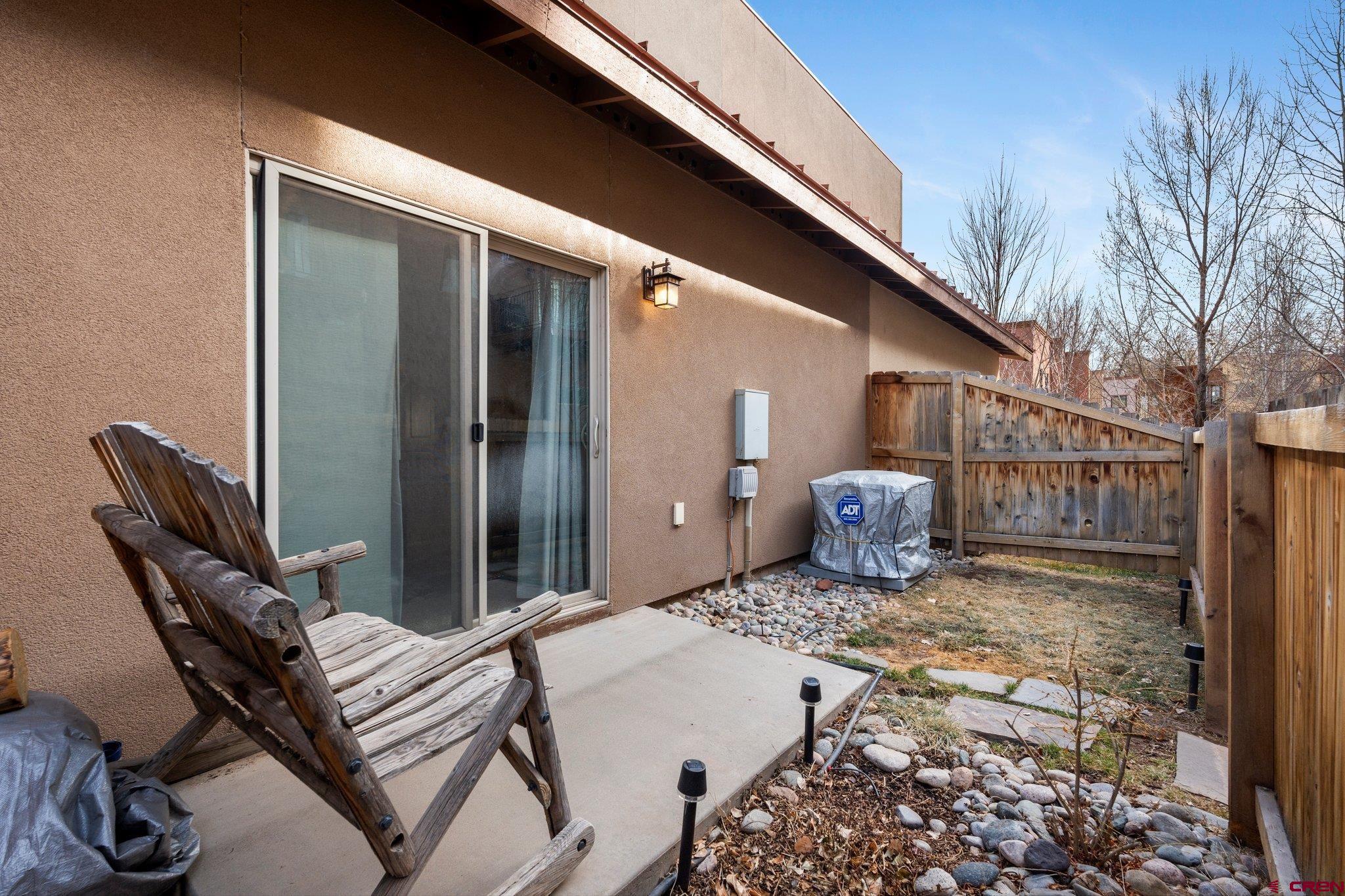 1422 Animas View Drive, Unit 25 Durango, CO 81301 - Photo 30 of 35 a view of a chair and table in backyard of the house