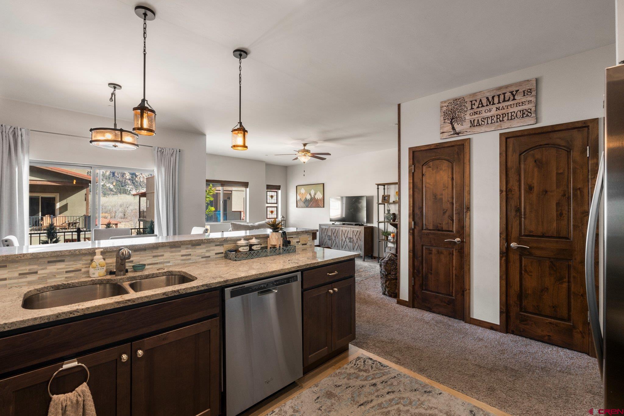 1422 Animas View Drive, Unit 25 Durango, CO 81301 - Photo 4 of 35 a kitchen with refrigerator and cabinets