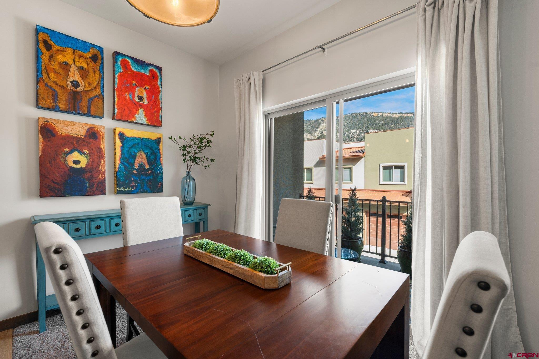 1422 Animas View Drive, Unit 25 Durango, CO 81301 - Photo 6 of 35 a living room with furniture and book shelf