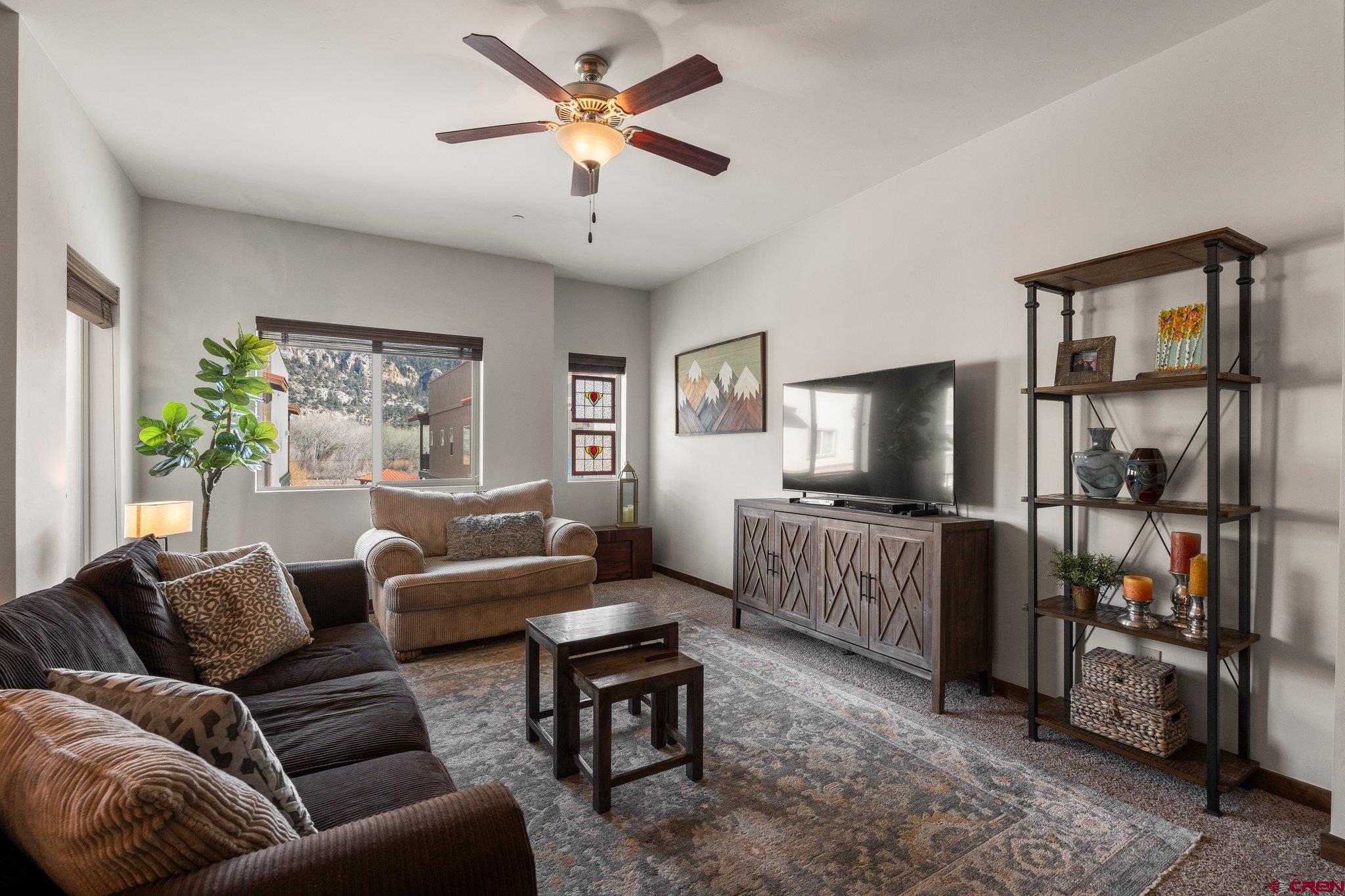 1422 Animas View Drive, Unit 25 Durango, CO 81301 - Photo 9 of 35 a living room with furniture and a flat screen tv