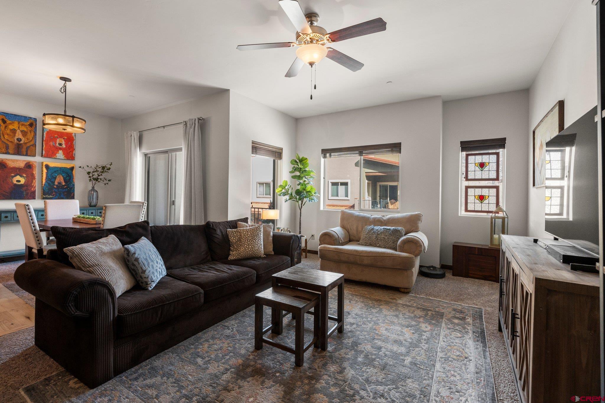 1422 Animas View Drive, Unit 25 Durango, CO 81301 - Photo 10 of 35 a living room with furniture and a chandelier