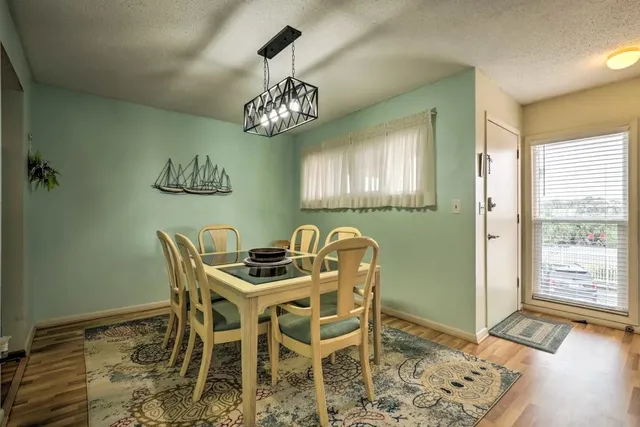 a bedroom with a bed and a night stand