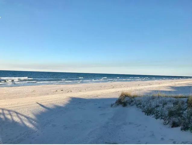 a view of a room and wooden floor