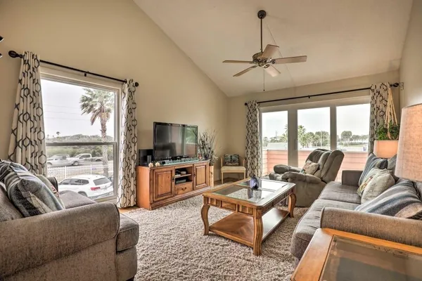 a living room with furniture and a flat screen tv