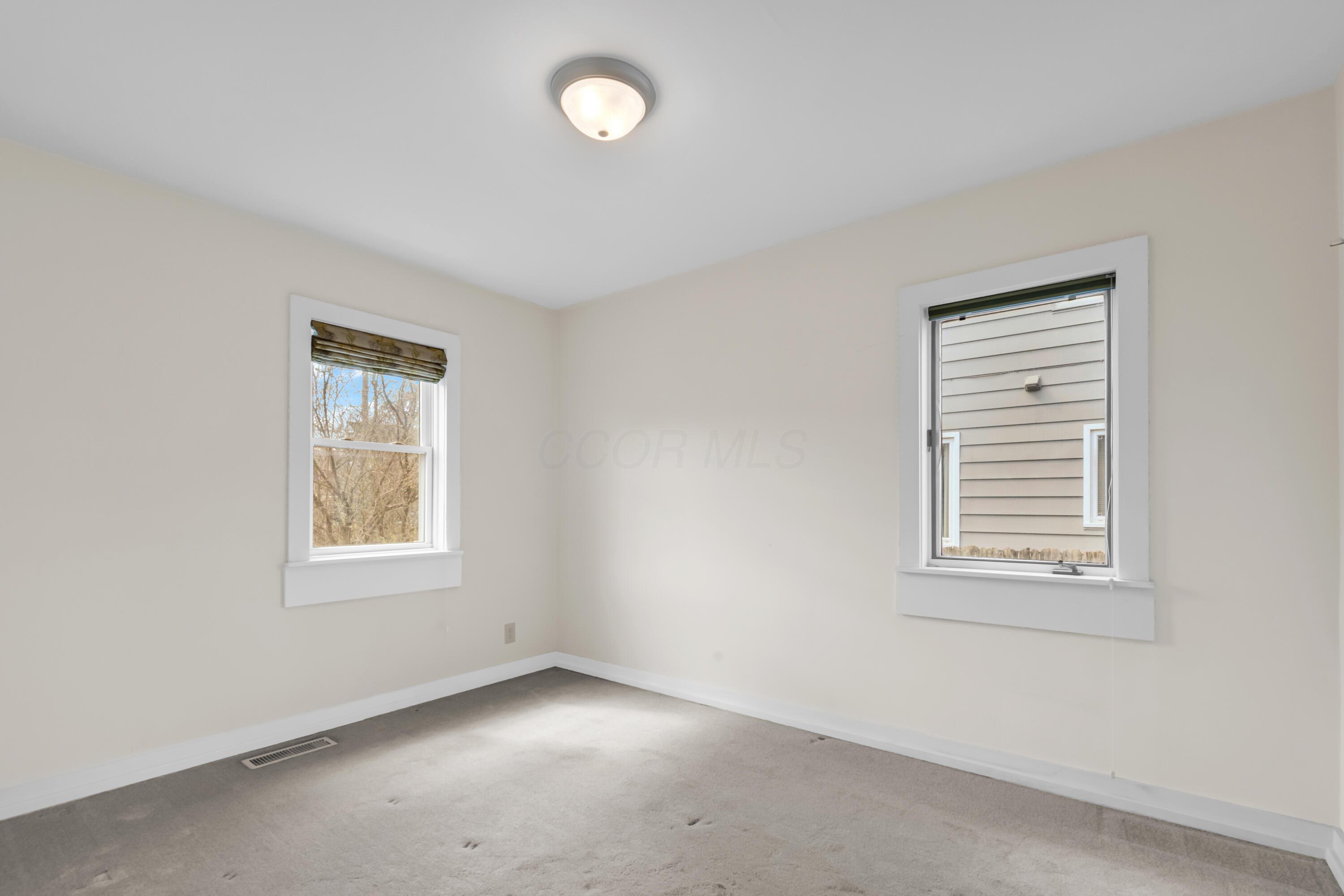 2033 Zollinger Road Columbus, OH 43221 - Photo 22 of 44 • Light sand carpet
• Ivory painted walls
• Ceiling light
• (2) single door closets
with attic access
• Shades remain