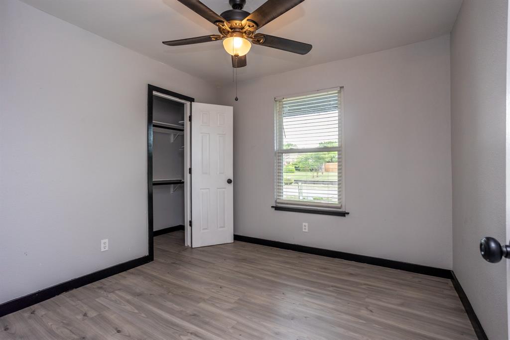 1206 Oakbluff Drive Lancaster, TX 75146 - Photo 19 of 23 Two front bedrooms are shaded by large trees in front yard