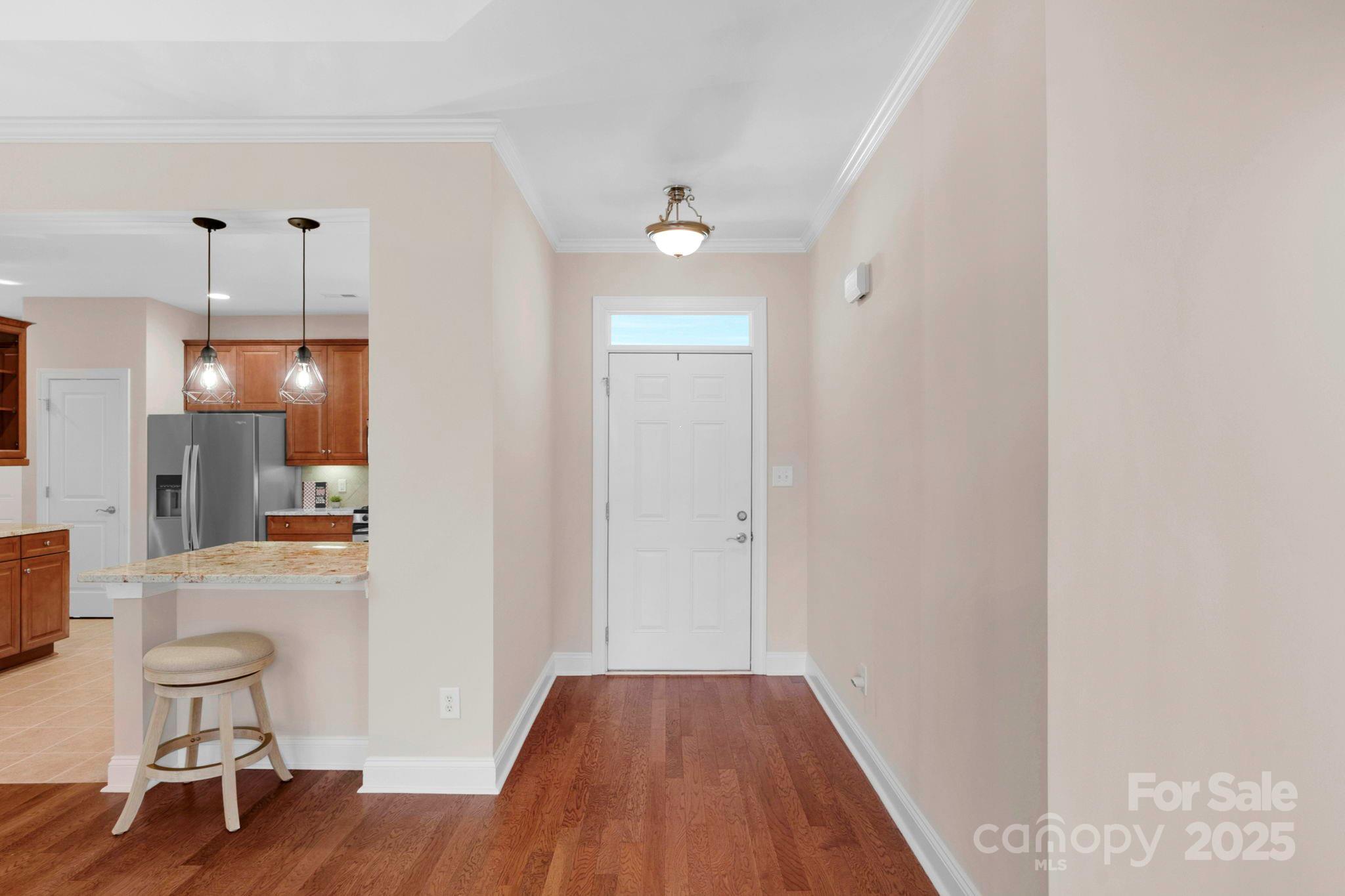 3038 Bellasera Way Matthews, NC 28105 - Photo 15 of 43 a view of a kitchen and dining area with chandelier