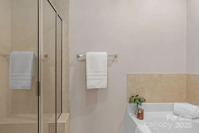 a bathroom with a tub and shower