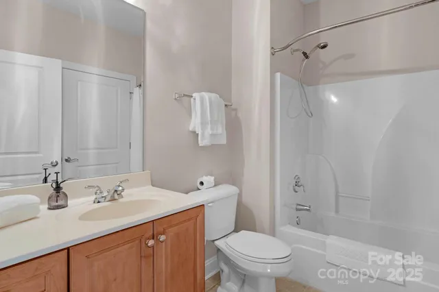 a bathroom with a sink toilet a mirror and shower