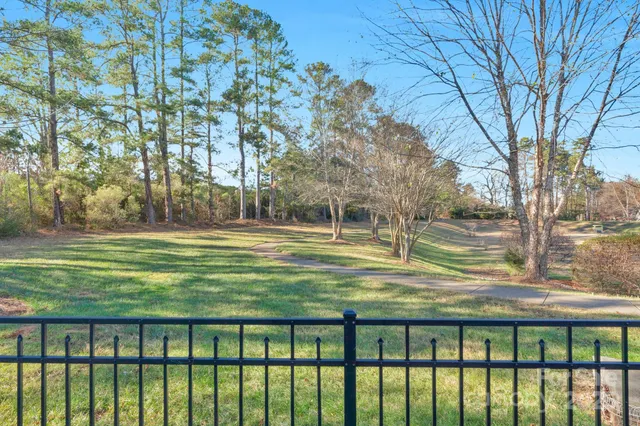a view of a swimming pool with a yard
