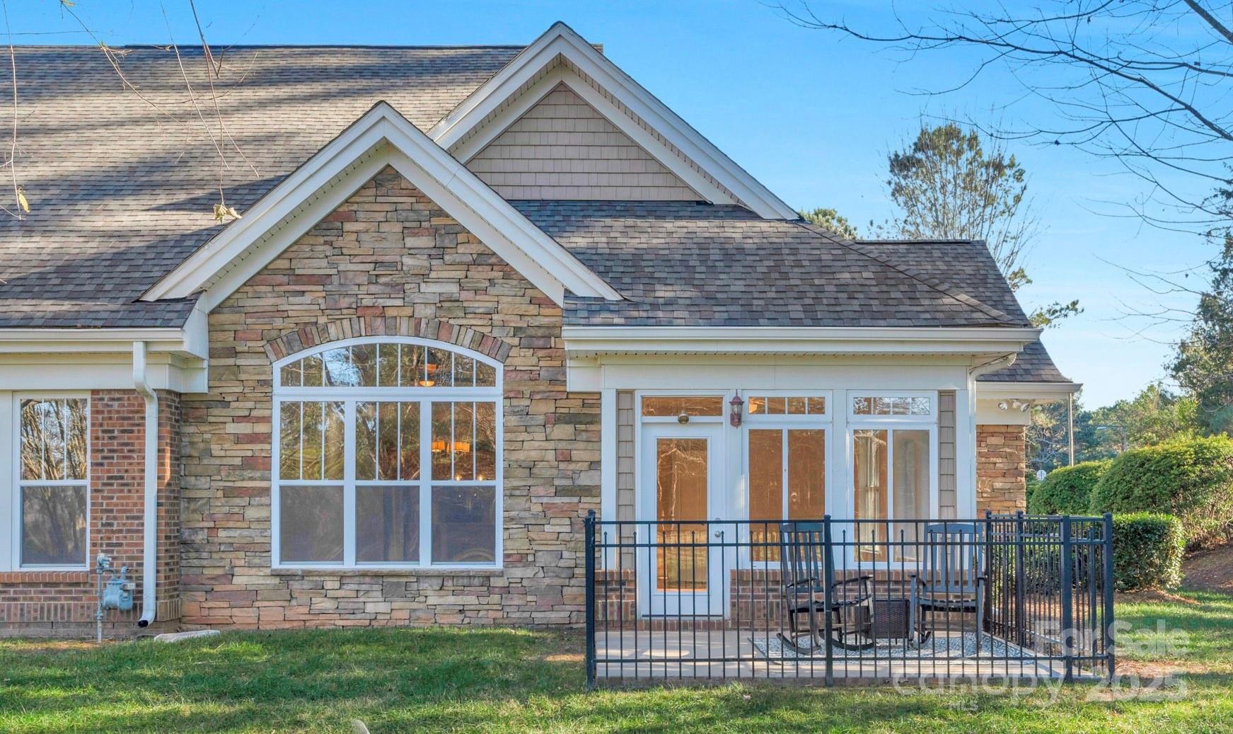 3038 Bellasera Way Matthews, NC 28105 - Photo 43 of 43 a front view of a house with a yard