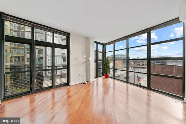 wooden floor with an empty room and window