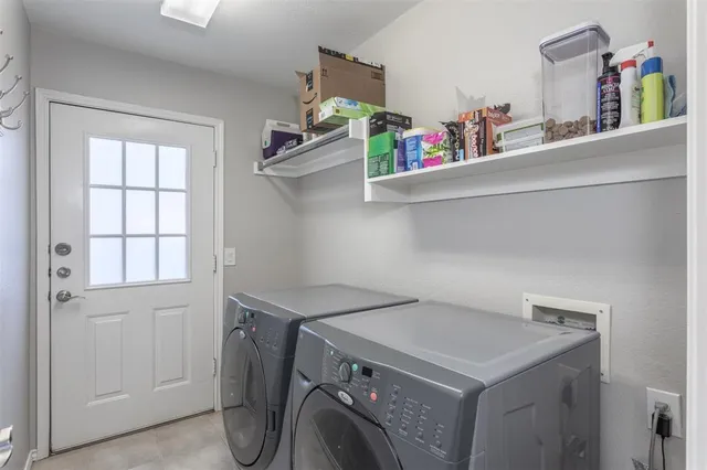 a utility room with dryer and washer