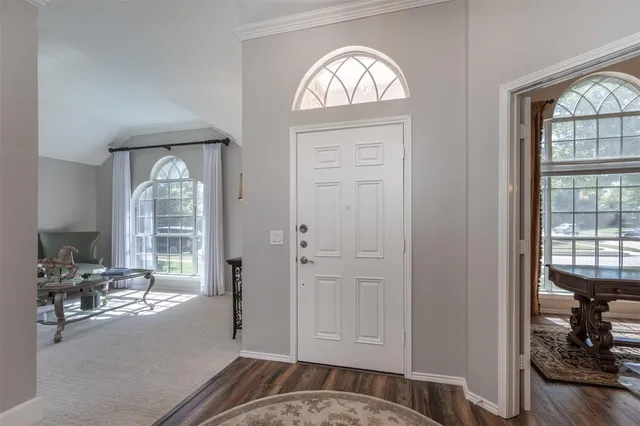 a view of hall way with furniture