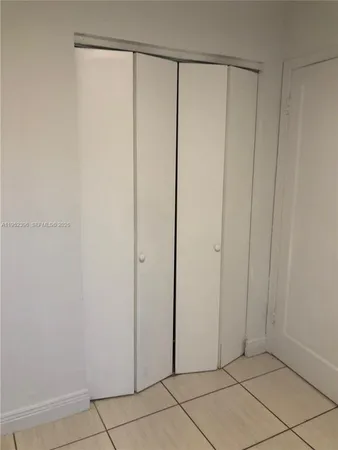 a view of a closet area with empty room