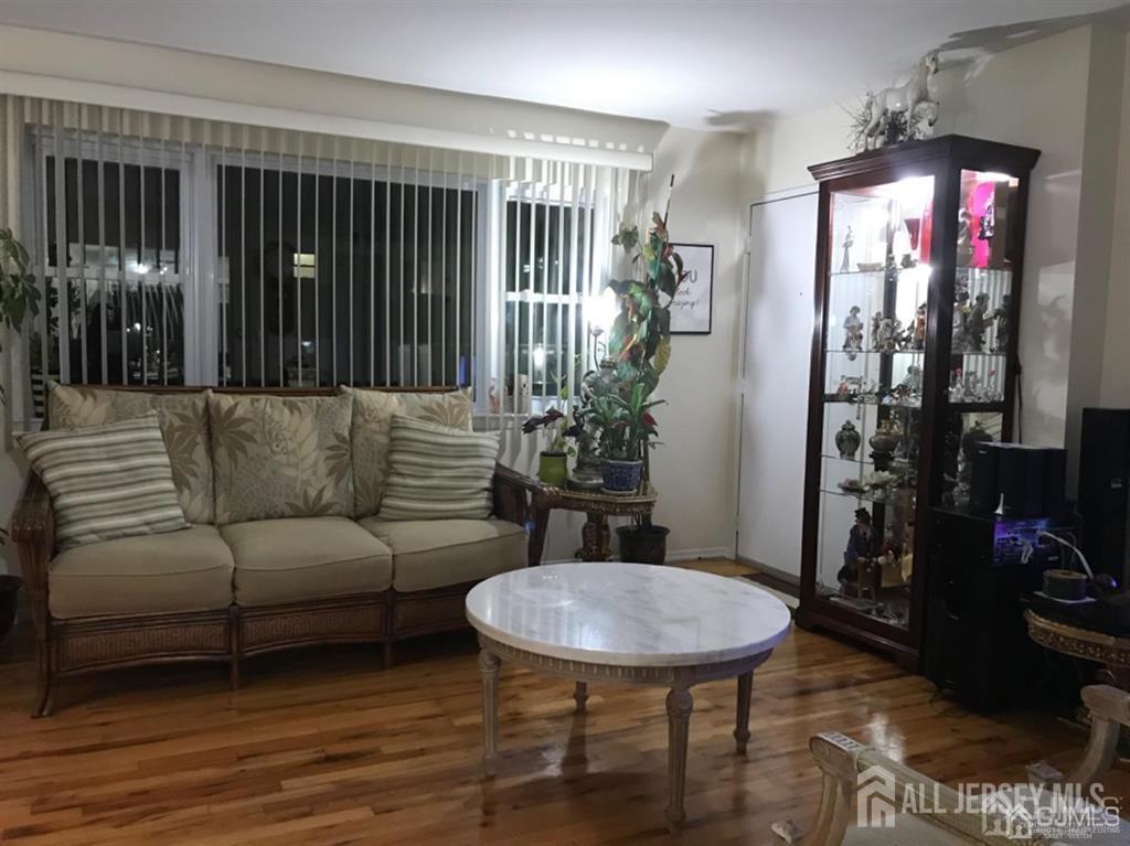 197 Evergreen Road Edison, NJ 08837 - Photo 3 of 7 a living room with furniture and a potted plant