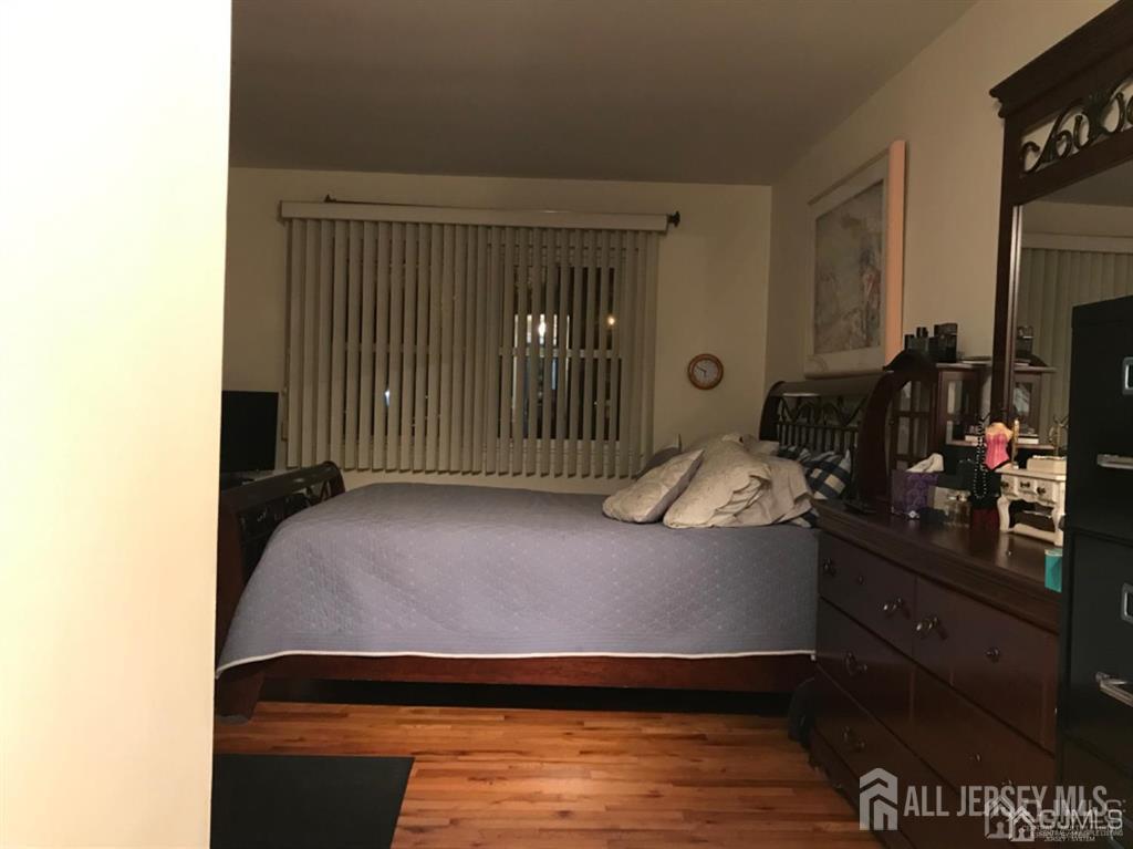 197 Evergreen Road Edison, NJ 08837 - Photo 5 of 7 a living room with furniture and a flat screen tv