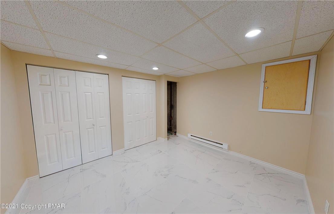 1110 Misty Ridge East Stroudsburg, PA 18302 - Photo 42 of 43 Clean, neutral walls and bright tile flooring await your personal touch.