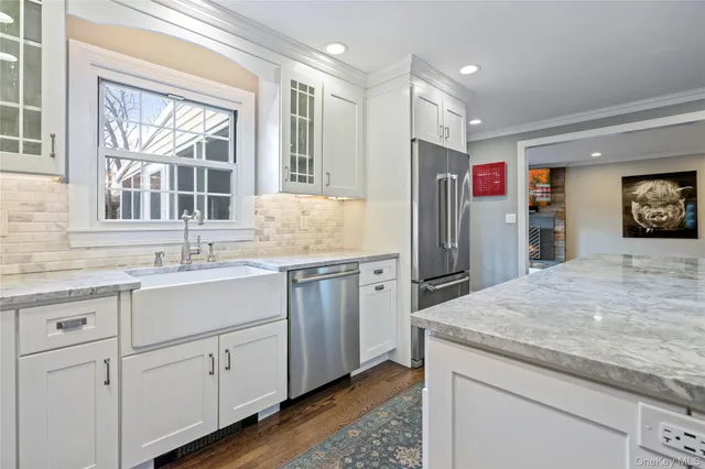 a kitchen with a stove a sink and a refrigerator