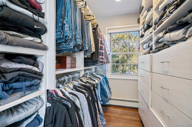 a bathroom with a granite countertop toilet a sink and a mirror