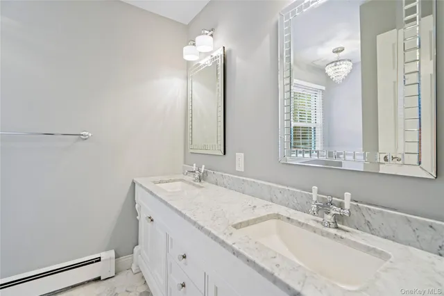 a white toilet sitting next to a bath tub shower