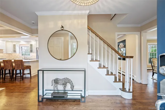 a view of entryway livingroom and hall with wooden floor