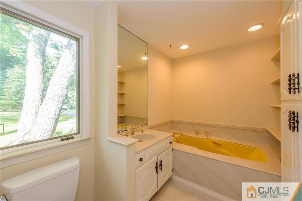 565 Foothill Road Bridgewater, NJ 08807 - Photo 12 of 25 a bathroom with a bathtub and a sink