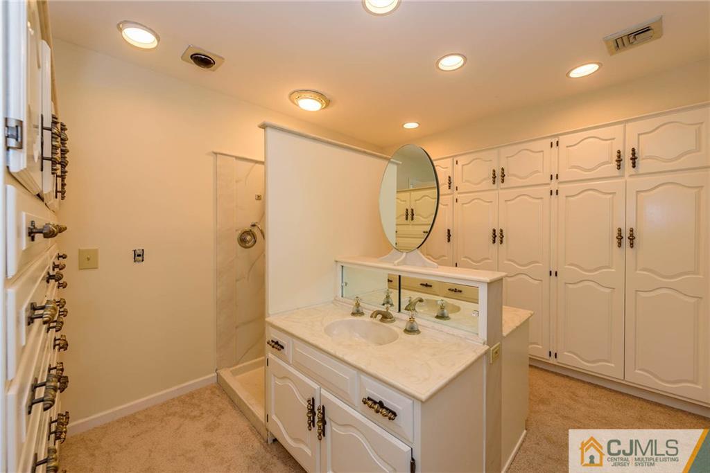565 Foothill Road Bridgewater, NJ 08807 - Photo 13 of 25 a bathroom with a sink a toilet and shower