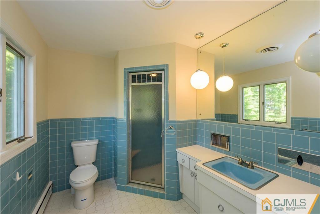 565 Foothill Road Bridgewater, NJ 08807 - Photo 15 of 25 a bathroom with a toilet sink and mirror