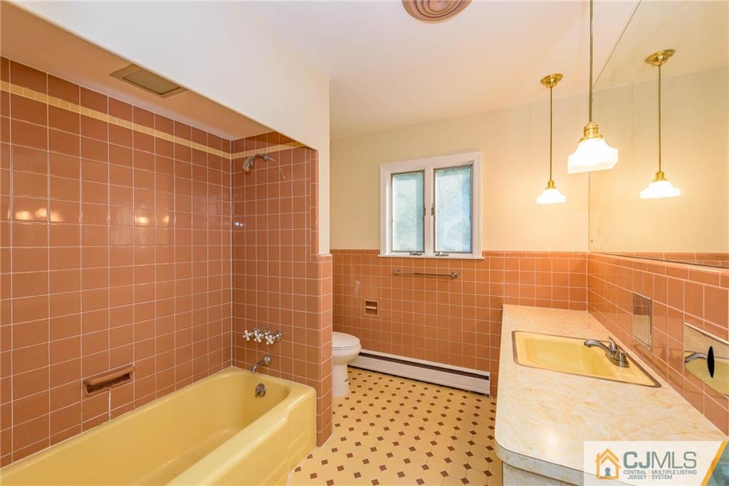 565 Foothill Road Bridgewater, NJ 08807 - Photo 19 of 25 a bathroom with a bathtub and a shower