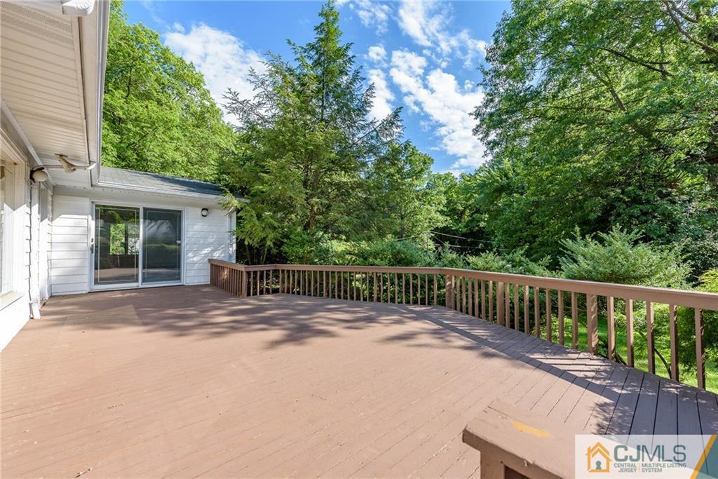 565 Foothill Road Bridgewater, NJ 08807 - Photo 23 of 25 a view of a deck with a large window and wooden fence