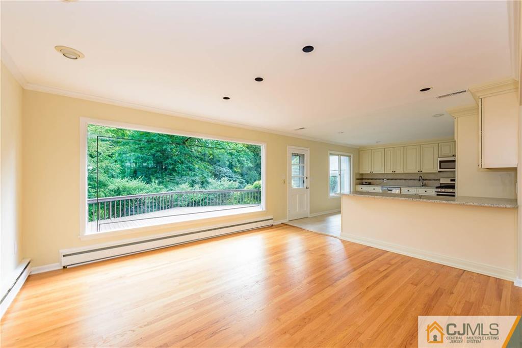 565 Foothill Road Bridgewater, NJ 08807 - Photo 4 of 25 a view of a kitchen with a sink and a large window