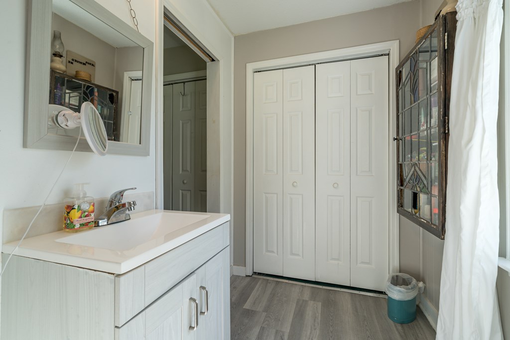 1813 John Smith Road East Blairsville, GA 30512 - Photo 19 of 41 a bathroom with a sink and a mirror
