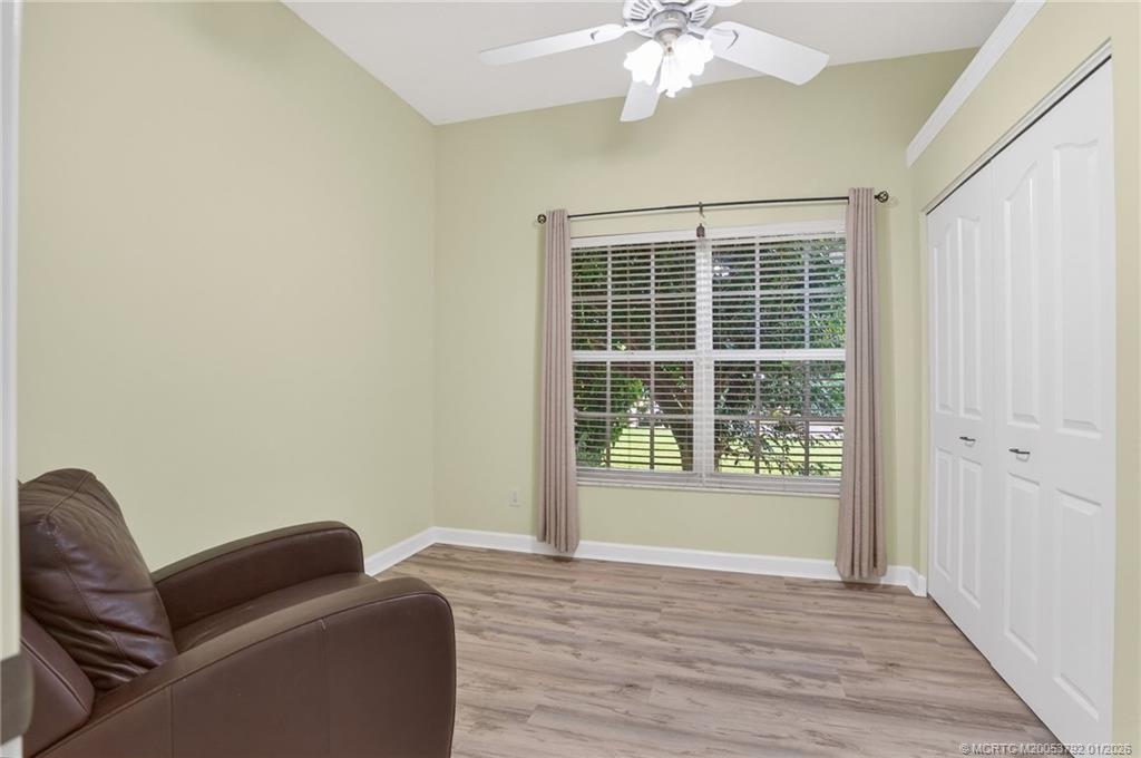 9275 Southeast Mercury Street Hobe Sound, FL 33455 - Photo 35 of 65 a living room with furniture and a window