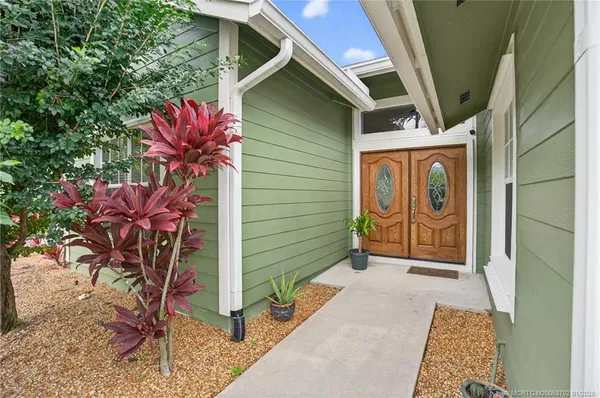 a bedroom with a bed and a ceiling fan