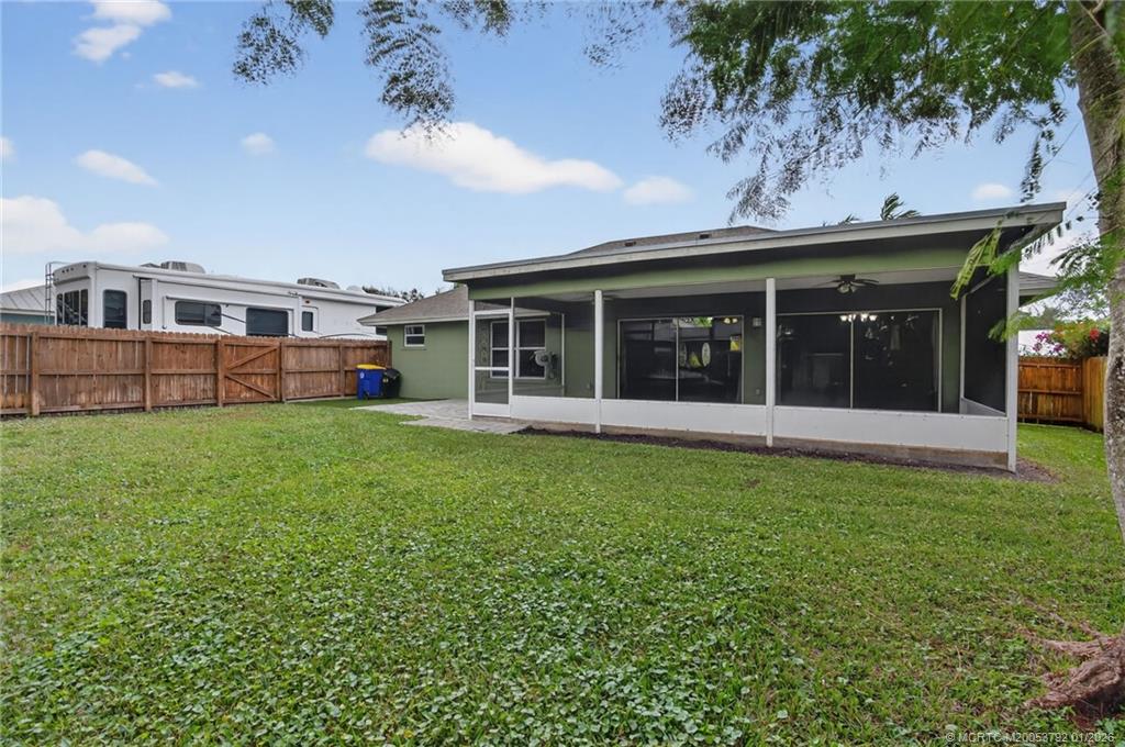 9275 Southeast Mercury Street Hobe Sound, FL 33455 - Photo 45 of 65 a view of a house with yard and porch