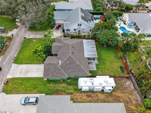an aerial view of residential house with outdoor space and swimming pool