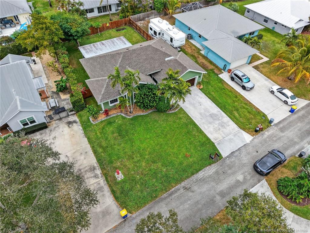 9275 Southeast Mercury Street Hobe Sound, FL 33455 - Photo 55 of 65 an aerial view of residential houses with outdoor space