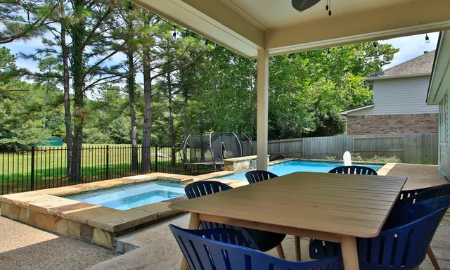 a view of a patio with swimming pool