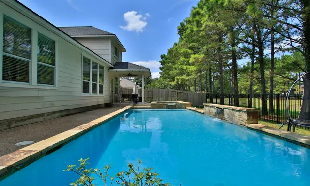 a view of a house with swimming pool