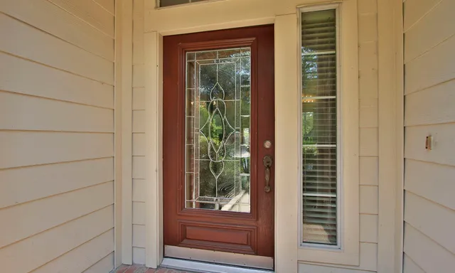 a view of a door and a window