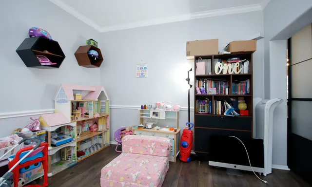 a room with toys and book shelf