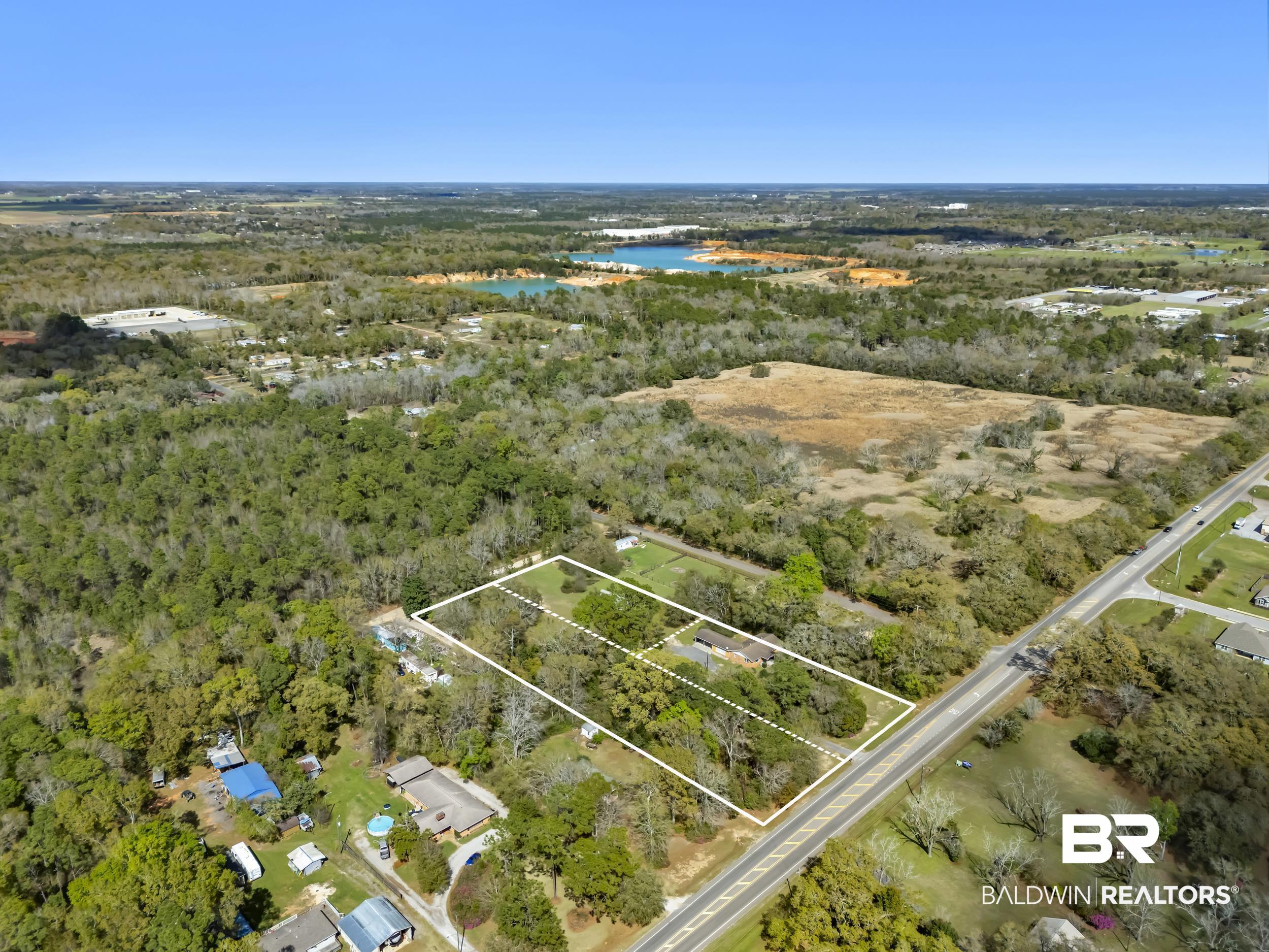 17463 Highway 98 Foley, AL 36535 - Photo 35 of 57 Aerial view of property's location featuring a nearby body of water and property boundaries highlighted