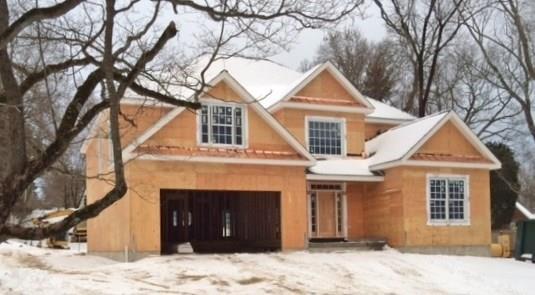 36 Woods End Road Fairfield, CT 06824 - Photo 1 of 1 a front view of a house with a yard covered in snow