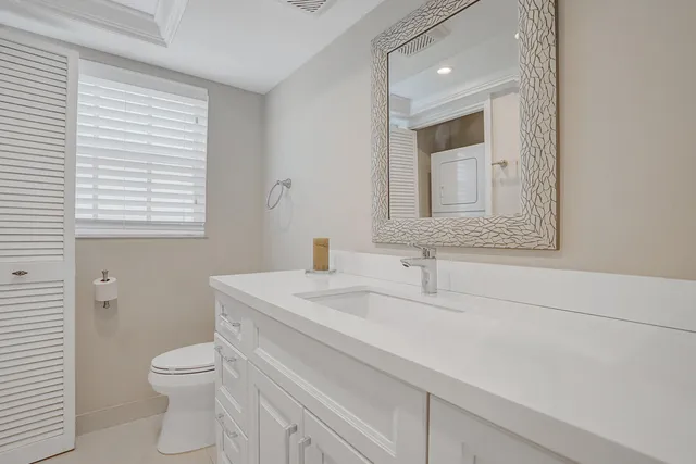 a bedroom with a bed and a chair