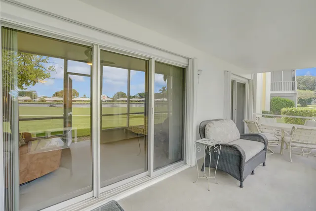 a very nice looking room with a large window and kitchen view