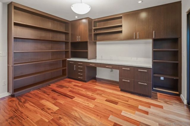 a view of an empty room with empty shelves