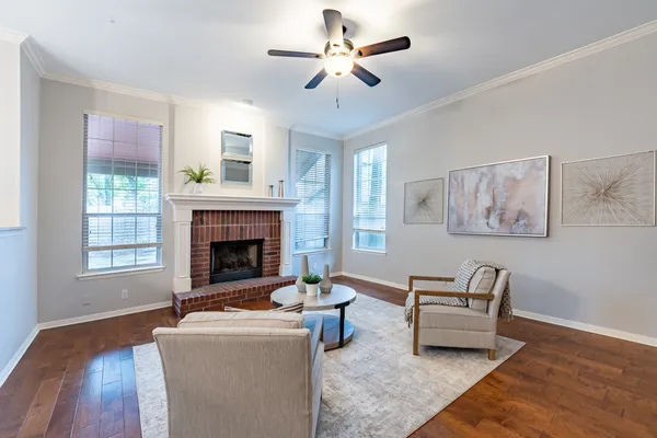a dining room with furniture a rug and a window